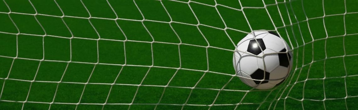 Football in back of the net